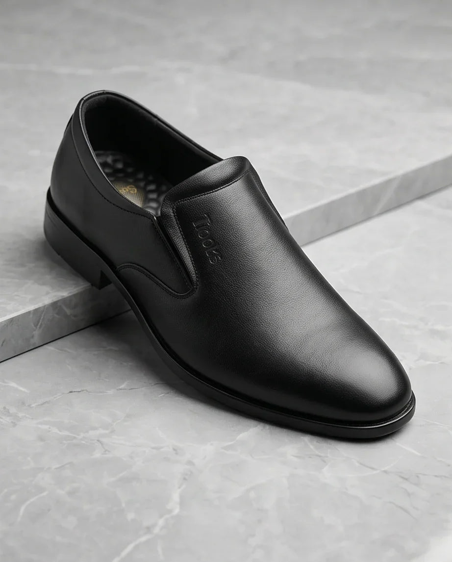 Premium black leather slip-on shoe for comfort & style, perfect for casual or formal wear