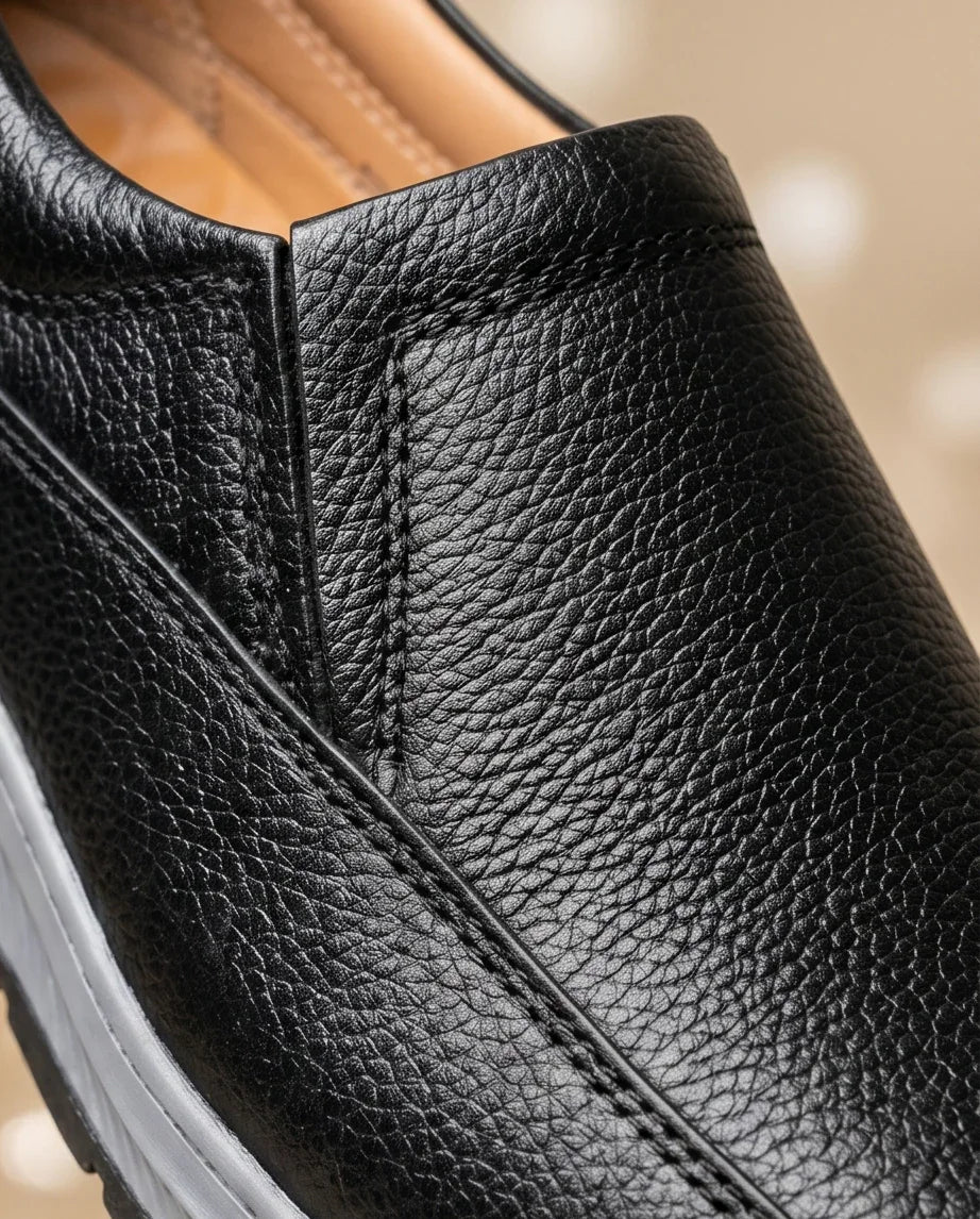 Close-up of a brown leather shoe with a GREY sole.