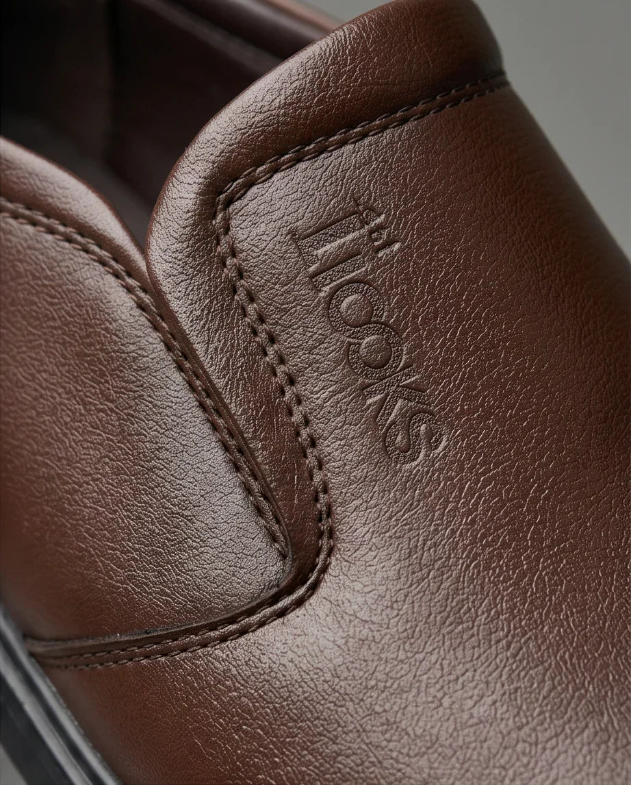 Brown leather slip-on shoe with embossed logo, premium comfortable stylish footwear