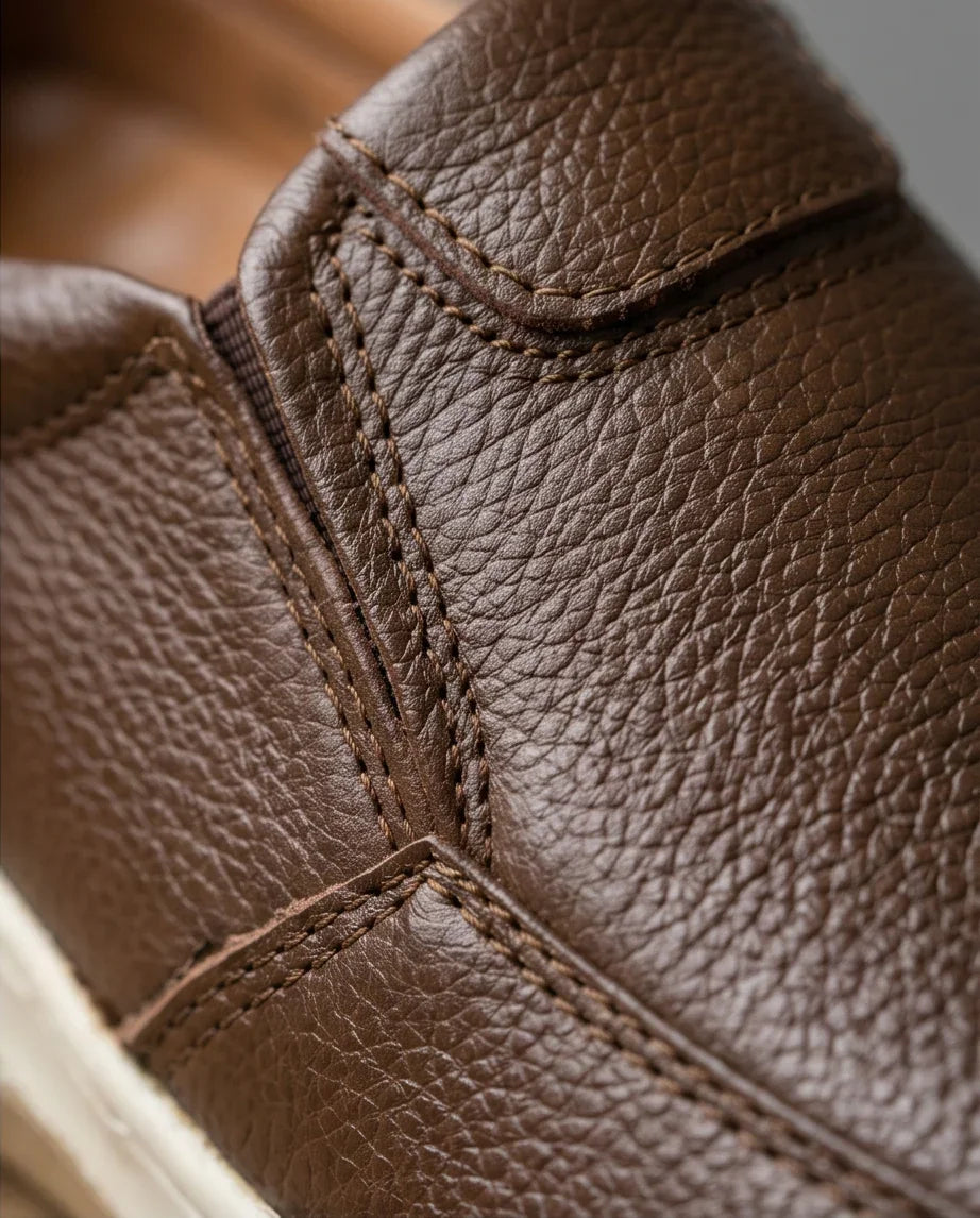 Premium brown leather sneaker with detailed stitching, stylish & comfortable footwear