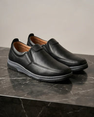 Premium black leather slip-on shoes for comfort and style, ideal for casual wear.