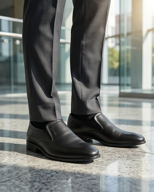 Stylish black leather slip-on dress shoes for men, perfect for formal or business casual wear